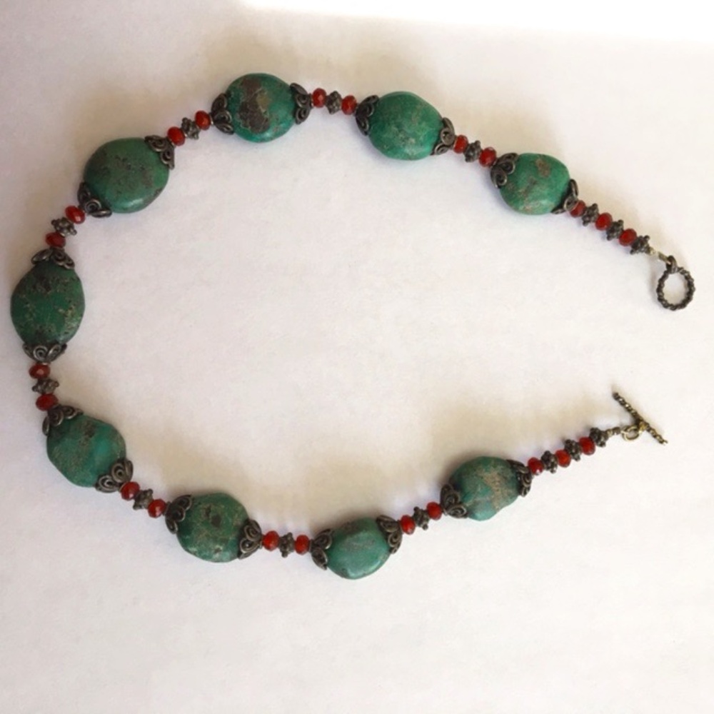 Like new. Chunky turquoise necklace with red beads and sliver clasp